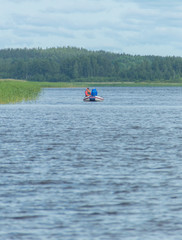 on an inflatable boat fishing couple.