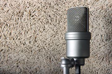 condenser microphone, the object is on insulating panel background with copy space