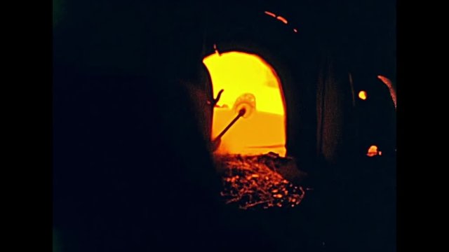 Touristic tour in Murano island in a glassworks factory with glass forged and in big furnaces. Amateur archive footage on 60s in Venice, Italy on June 1967.