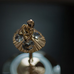 Top view of ballerina statuette on music box.
