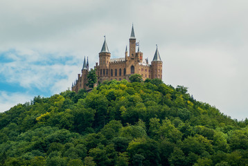 Fototapeta na wymiar Castle Hohenzollern on the green hill