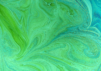 Marbled green and golden abstract background. Liquid marble pattern