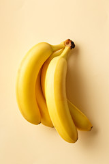 Bananas on a yellow background. Exotic fruit viewed from above. Top view.