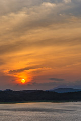 Dusk and sunset at Giritale Tank famous reservoir in Sri Lanka built by King Agbo 11 where wild animals like Elephants, Deer come to drink water, overlooking the Giritale Hotel