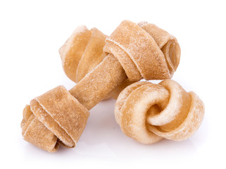 Artificial a bone for a dog with vitamins on white background