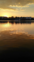 Sunset on lake. Clouds reflecting in the water_2
