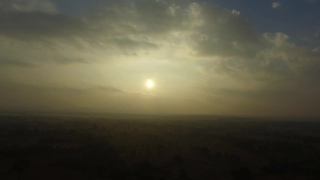 Sunrise from hot air balloon over the misty Old Bagan landscape in Myanmar.