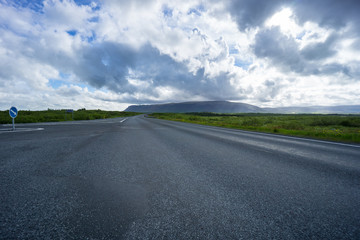 Iceland - Highway intersection between green meadows