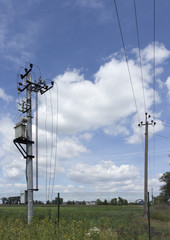 Fototapeta na wymiar Power line post with multiple wires