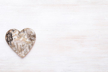 Background with wooden hearts, place for text.