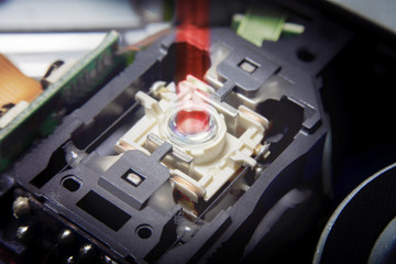 Close up macro. Laser Head reader of cd player system equipment installed on electronics circuit board with selective focus. Electronics equipment concept.