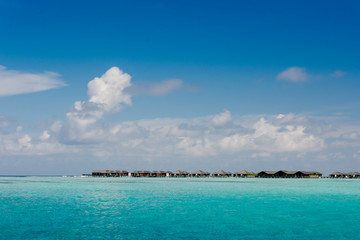 Fototapeta na wymiar Water Villas, Overwater Bungalows in Maldives