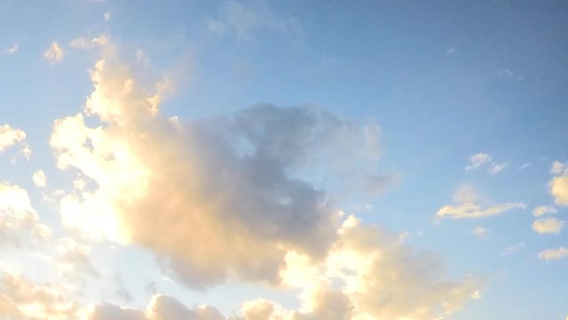 sunset Clouds float on blue sky timelapse