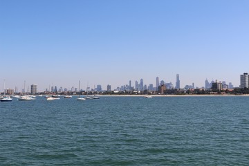 Cityskyline viewed from the sea with boats and space for text