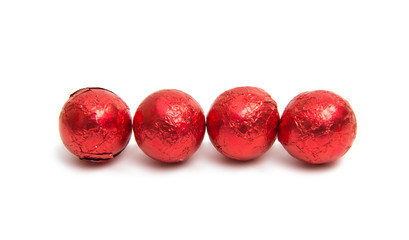 Chocolate candies in foil isolated