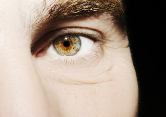 Image of man's beautiful insightful look eye close up.