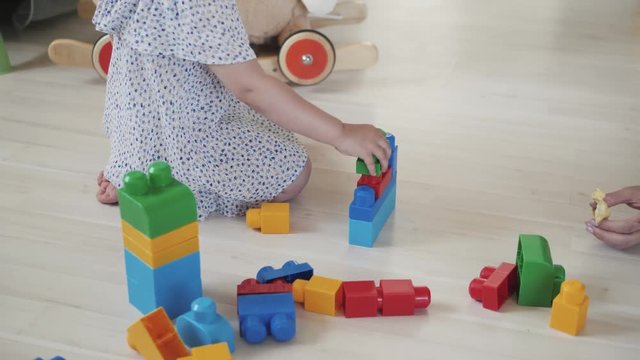 child little girl playing wooden toys at home or kindergarten, baby kid intellectual games children's desinger