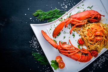 Omar boiled in spices and seafood pastes. On a wooden background. Top view. Free space for your text.