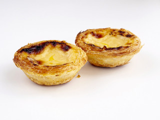 Custard tarts on white background