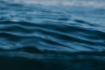 ripples in ocean water at dusk