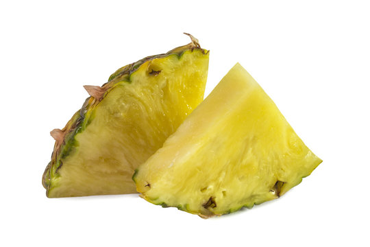 Two triangular pieces of ripe yellow pineapple