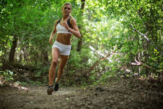 Woman Running In The Forrest