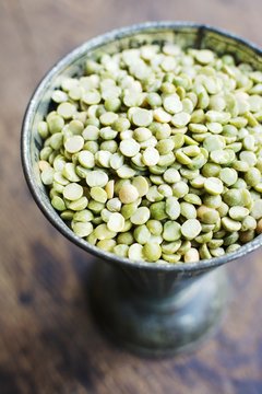 Green split peas in a measuring cup