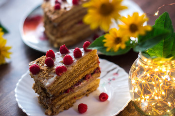 Homemade cake baking on a platter on a wooden background.