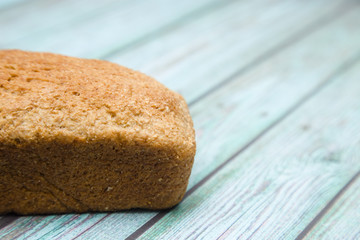 Loaf of Whole Wheat Bread on a Blue Wood Table