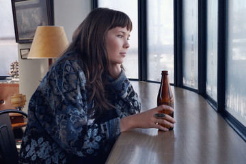 Lonely single female at the bar drinking