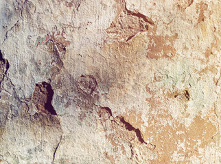 Holes on the cement covering of the old wall