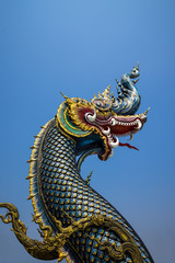 Fototapeta na wymiar The naga statue on blue sky background in thailand.