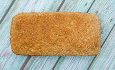 Loaf of Whole Wheat Bread on a Blue Wood Table