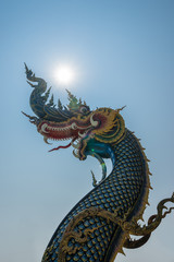 Fototapeta na wymiar The naga statue on blue sky background in thailand.
