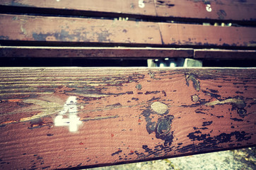 Number four painted on an old wooden seat, conceptual picture with copy space on the right.