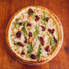 delicious pizza with meat, cheese and mushrooms