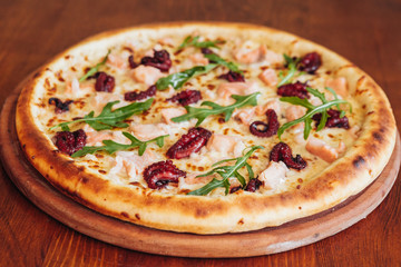 delicious pizza with meat, cheese and mushrooms