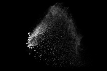 Freeze motion of white dust explosion on black background. Stopping the movement of white powder on dark background. Explosive powder white on black background. - 165842042