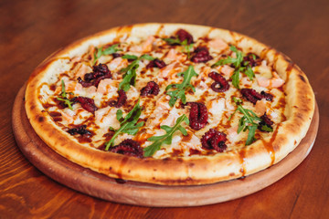 delicious pizza with meat, cheese and mushrooms