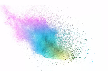 Abstract art powder paint on white background. Movement abstract frozen dust explosion multicolored...