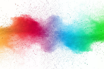 Abstract art powder paint on white background. Movement abstract frozen dust explosion multicolored on white background. Stop the movement of colored powder on white background.