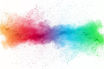 Abstract art powder paint on white background. Movement abstract frozen dust explosion multicolored...