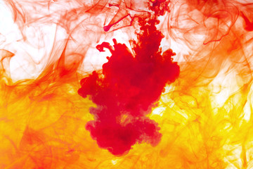 red and orange ink in water