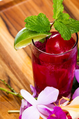 refreshing tropical cocktail with fresh flowers