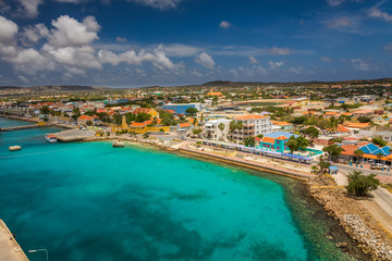 Naklejka na ściany i meble Arriving at Bonaire, capture from Ship at the Capital of Bonaire, Kralendijk in this beautiful island of the Ccaribbean Netherlands, with its paradisiac beaches and water.