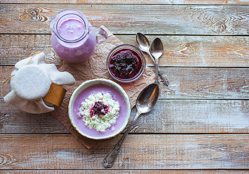 Gentle cottage cheese with blueberry yogurt and bilberry jam. Food background. Breakfast morning concept.