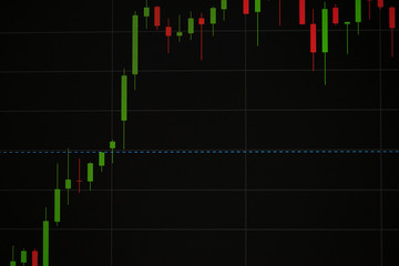 Fototapeta premium Concept of business and investments in stock market. Multi-colored graphics.