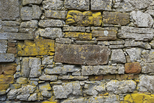 Hand built stone wall with lichen growth