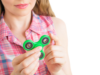 Girl holding a colourful hand fidget spinner toy