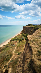 Fototapeta premium Aerial view of beautiful cliff over sea coast